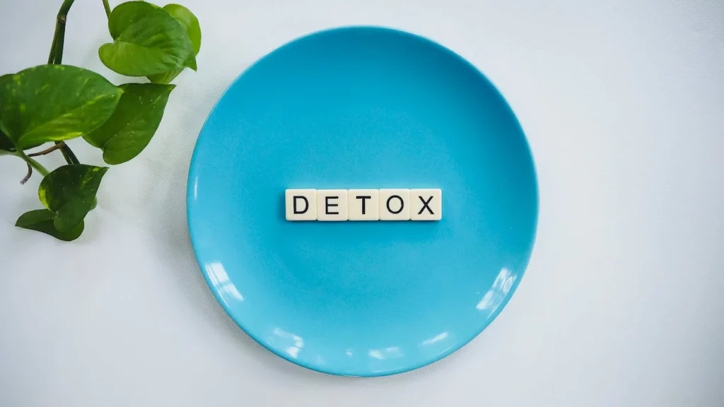 detox scrabble letters on blue plate