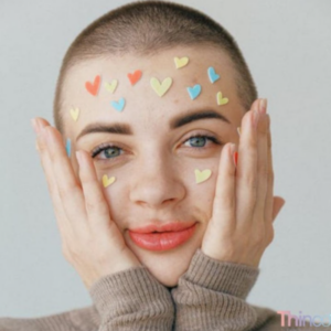 woman holding face with love heart stickers