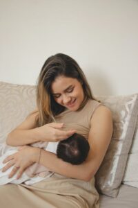 woman breastfeeding in bed